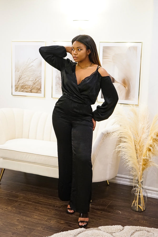 jumpsuit, black, satin, polyester, off the shoulder, camisole, one piece, side pockets, evening wear, date night, lace detail, shoulder strap, one sleeve, two sleeve, elegant jumpsuit, womens clothing, timeless fashion, balloon sleeve, business wear, office attire, fashionable 